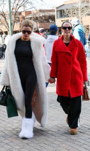 Brooks Nader in a White Fur Coat