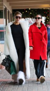 Brooks Nader in a White Fur Coat