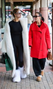 Brooks Nader in a White Fur Coat