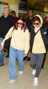 Camila Mendes in a Yellow Hoodie