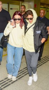 Camila Mendes in a Yellow Hoodie