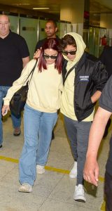 Camila Mendes in a Yellow Hoodie