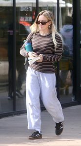 Hilary Duff in a Black Adidas Sneakers