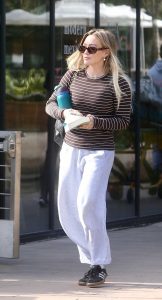 Hilary Duff in a Black Adidas Sneakers