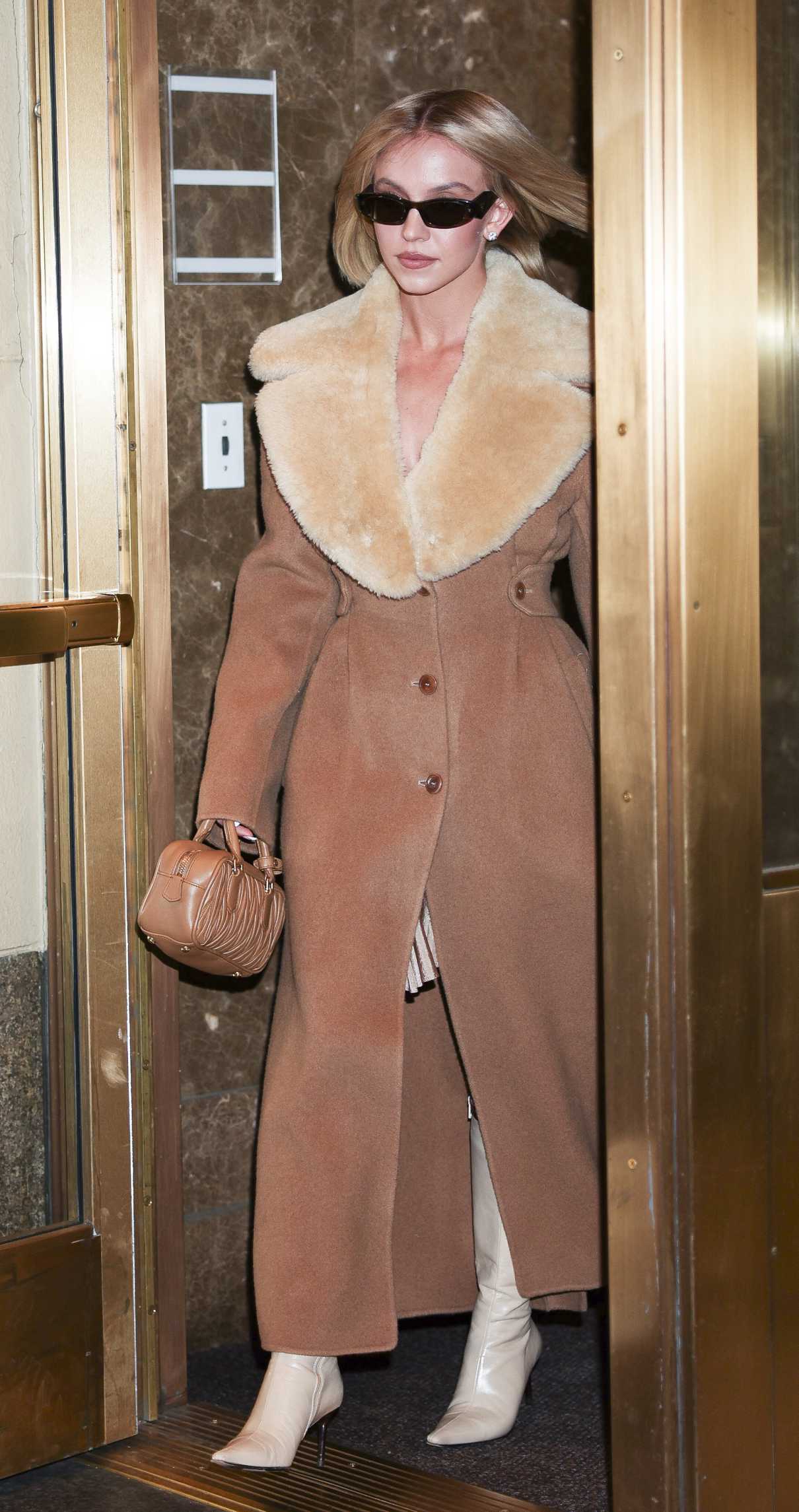 Sydney Sweeney in a Tan Coat