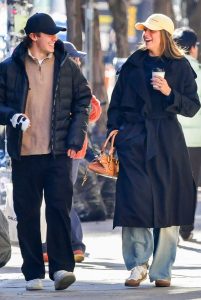 Tate McRae in a Black Trench Coat