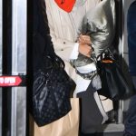 Zendaya in an Orange Hood Arrives at JFK Airport in New York City 12/16/2025