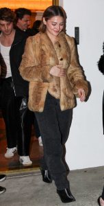 Madelyn Cline in a Beige Fur Coat