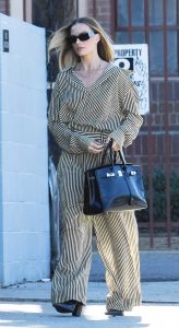 Margot Robbie in a Striped Pantsuit