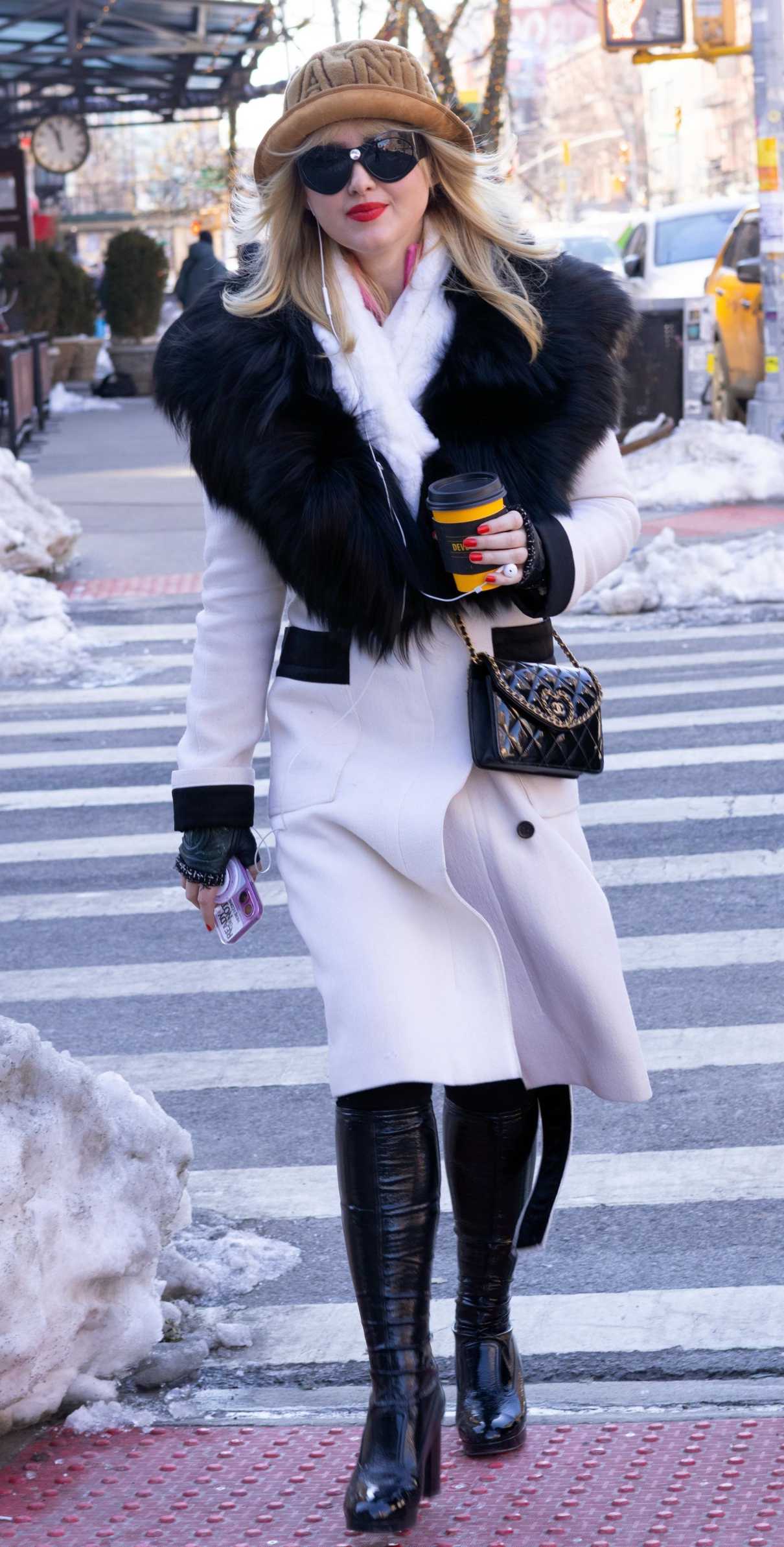 Kathryn Newton in a White Coat Was Seen Out in SoHo in New York City 02/15/2026