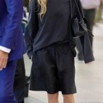 Margot Robbie in a Black Shorts Arrives at Airport in Sydney 02/22/2026