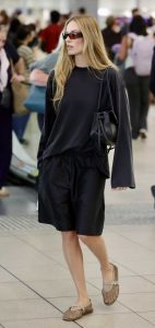 Margot Robbie in a Black Shorts