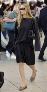 Margot Robbie in a Black Shorts