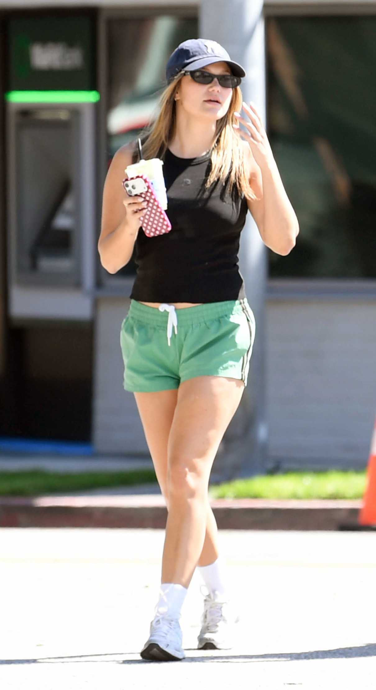 Olivia Holt in a Black Cap