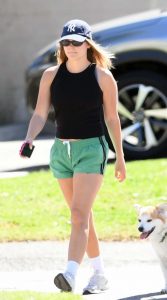 Olivia Holt in a Black Cap