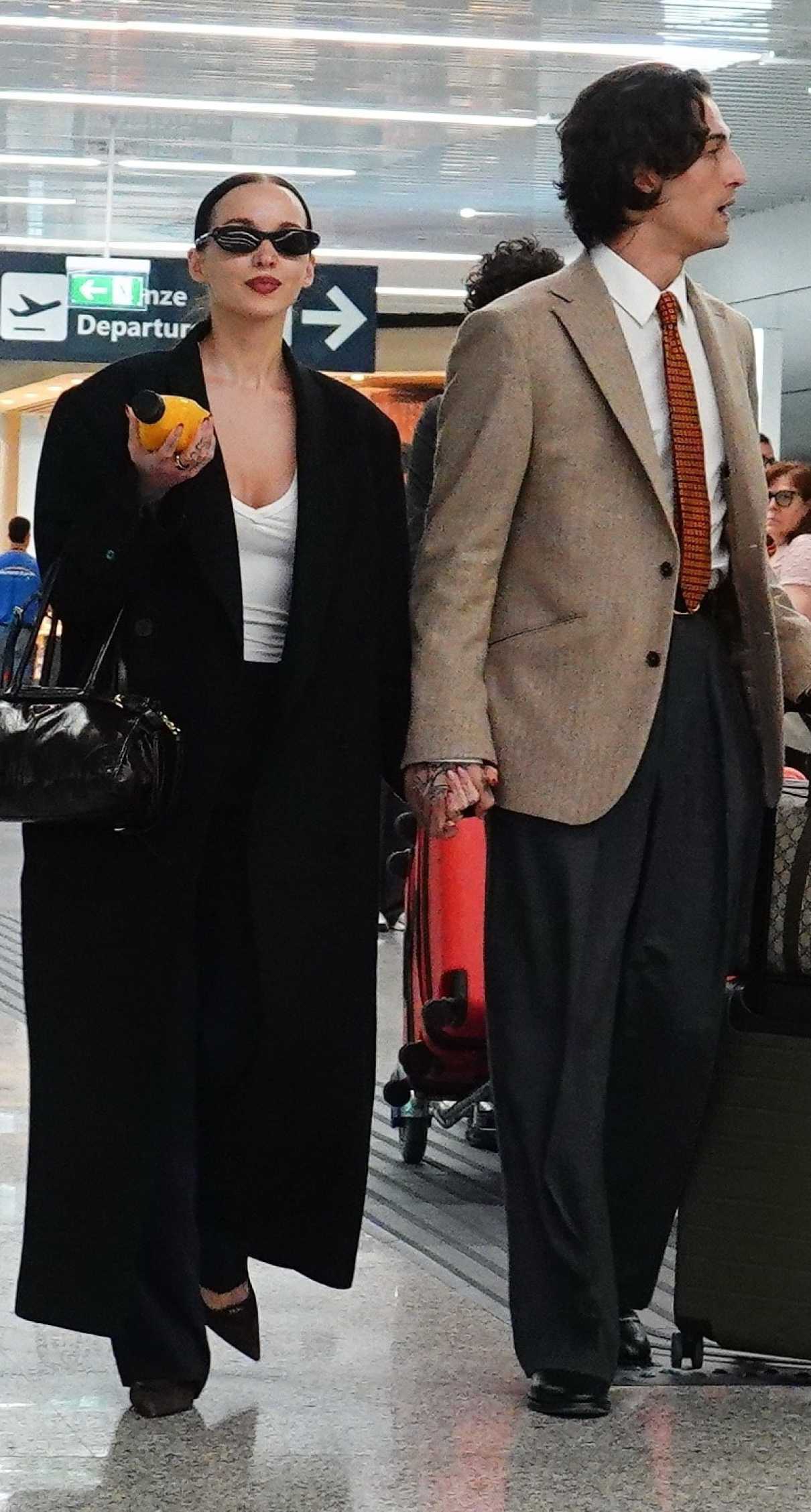 Dove Cameron in a Black Coat