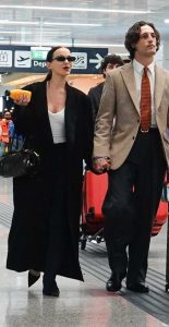 Dove Cameron in a Black Coat