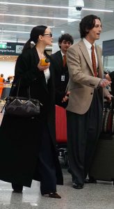 Dove Cameron in a Black Coat