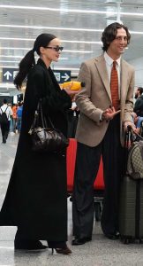 Dove Cameron in a Black Coat