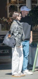 Lily Collins in a Black Leather Jacket