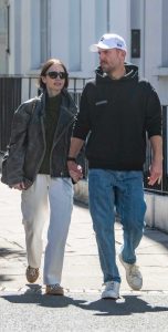 Lily Collins in a Black Leather Jacket