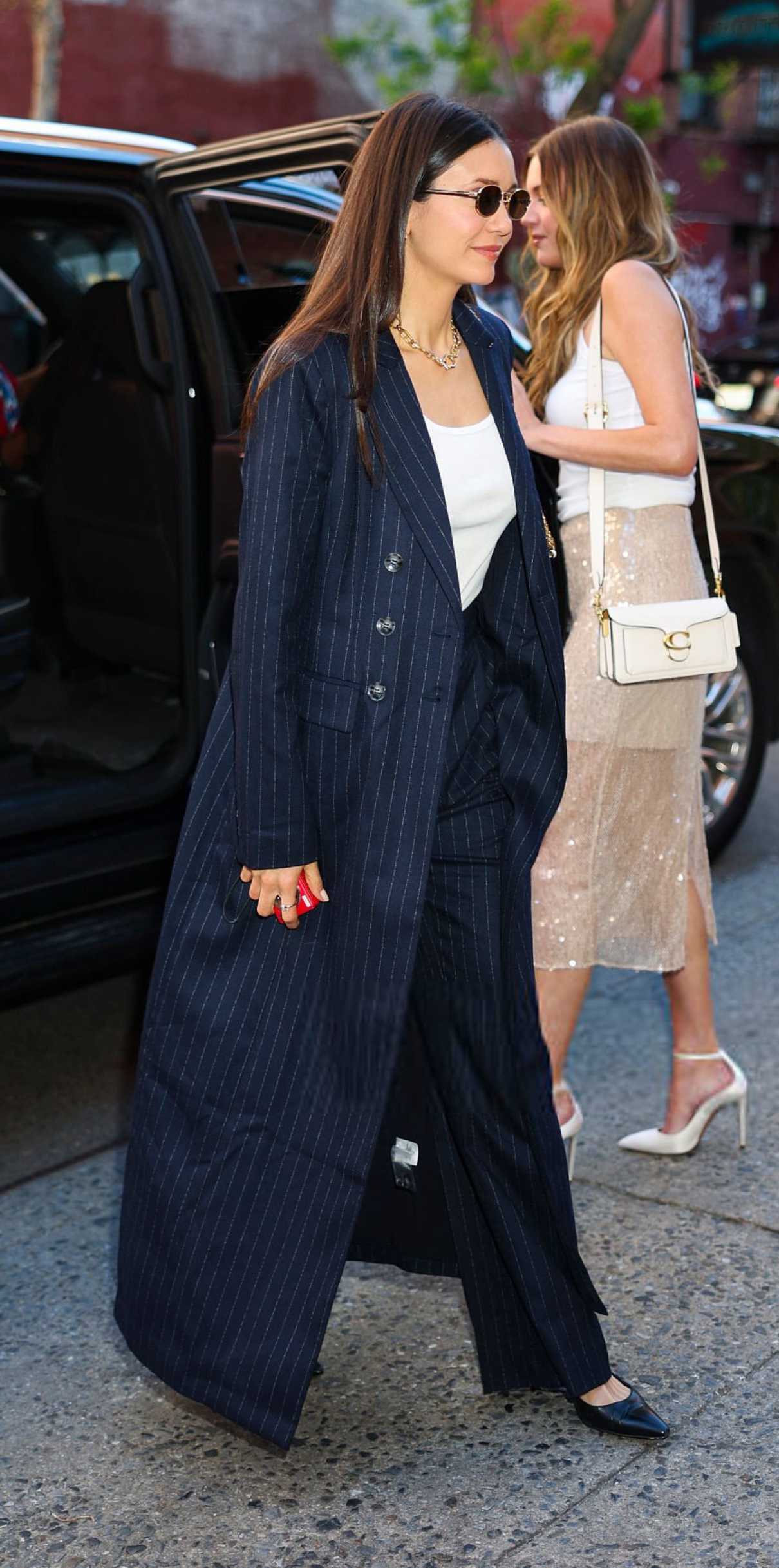 Nina Dobrev in a Navy Pinstriped Ensemble