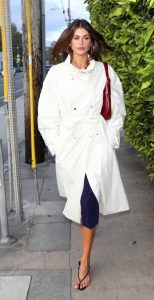 Kaia Gerber in a White Trench Coat