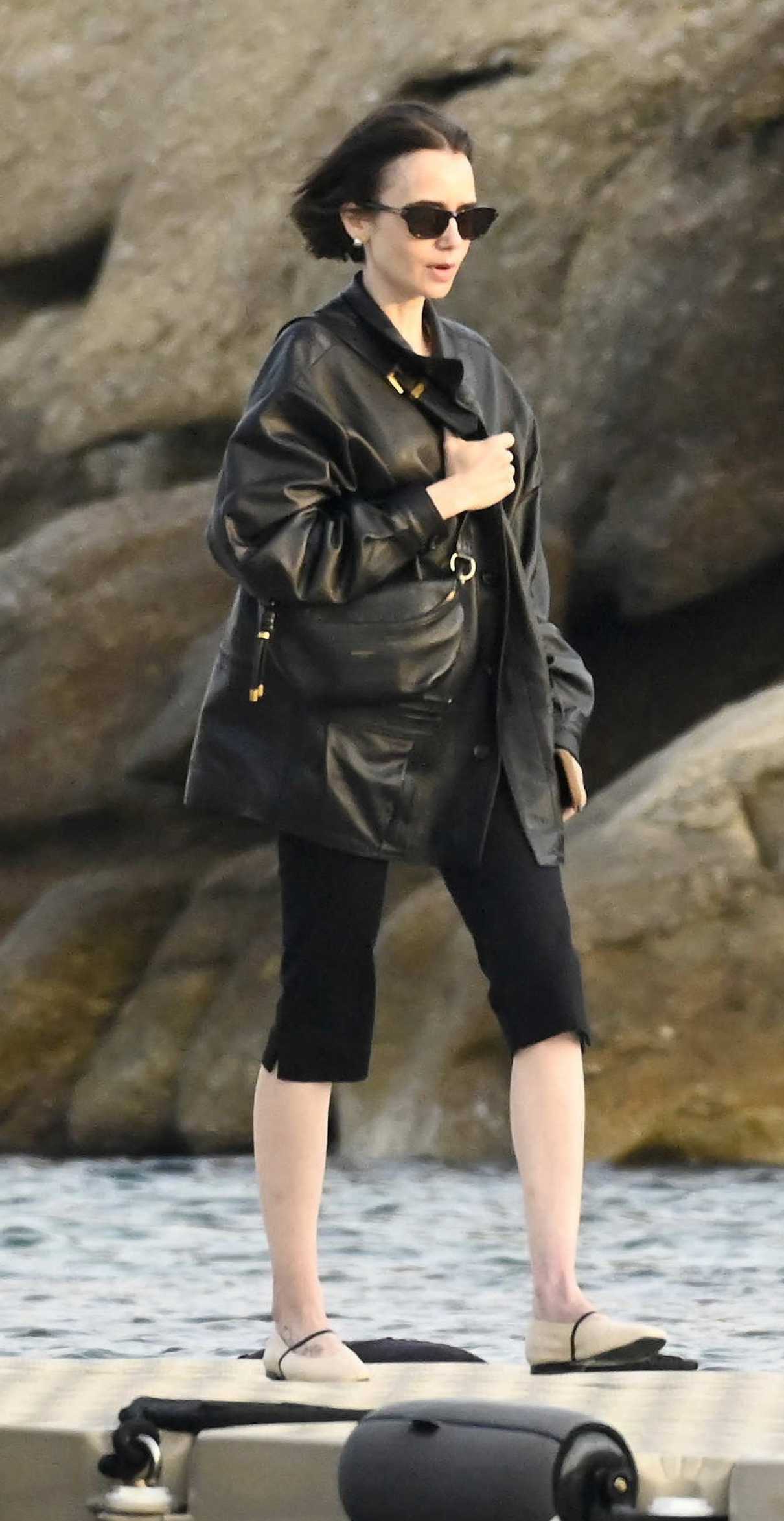 Lily Collins in a Black Leather Jacket