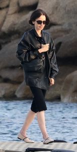 Lily Collins in a Black Leather Jacket