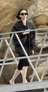 Lily Collins in a Black Leather Jacket