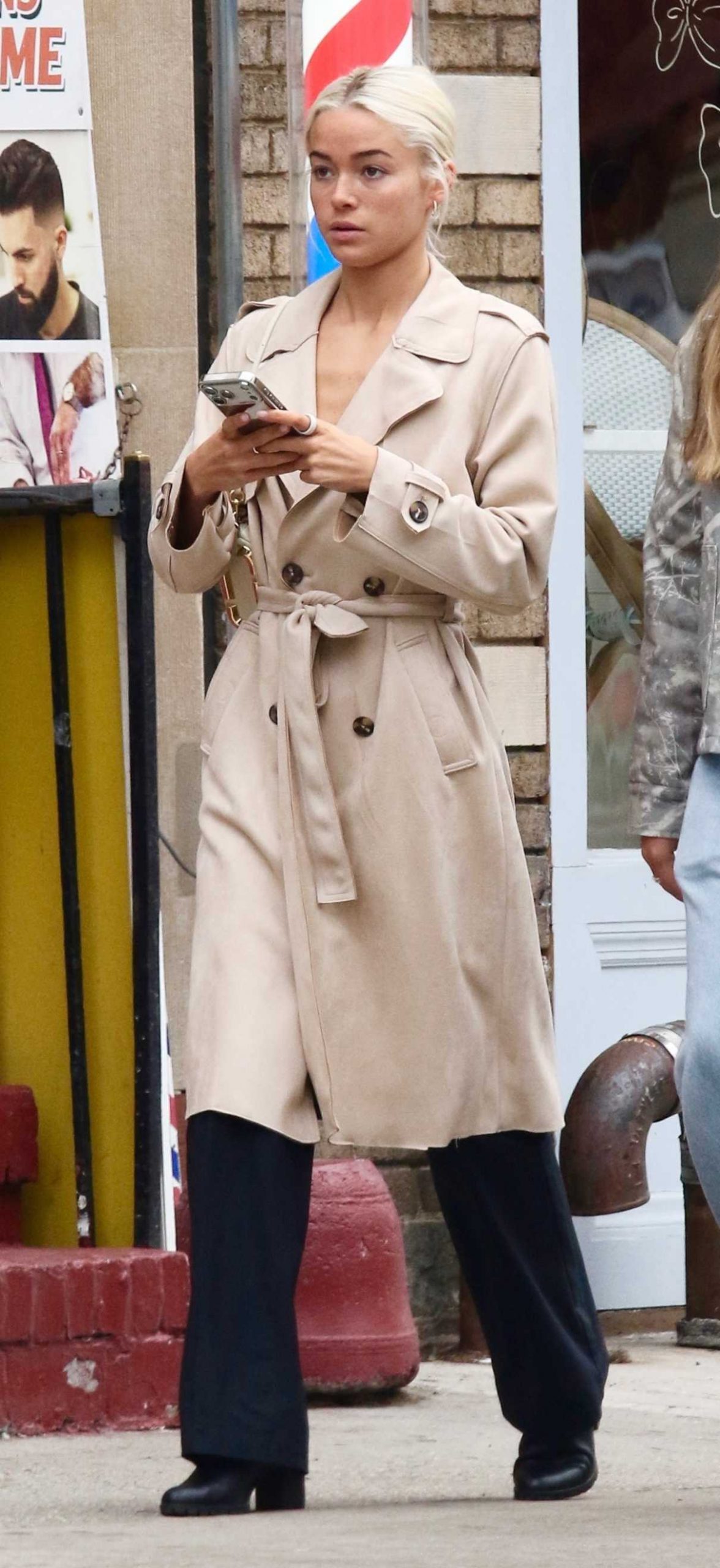 Olivia Dunne in a Beige Trench Coat