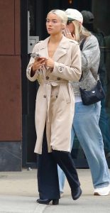Olivia Dunne in a Beige Trench Coat