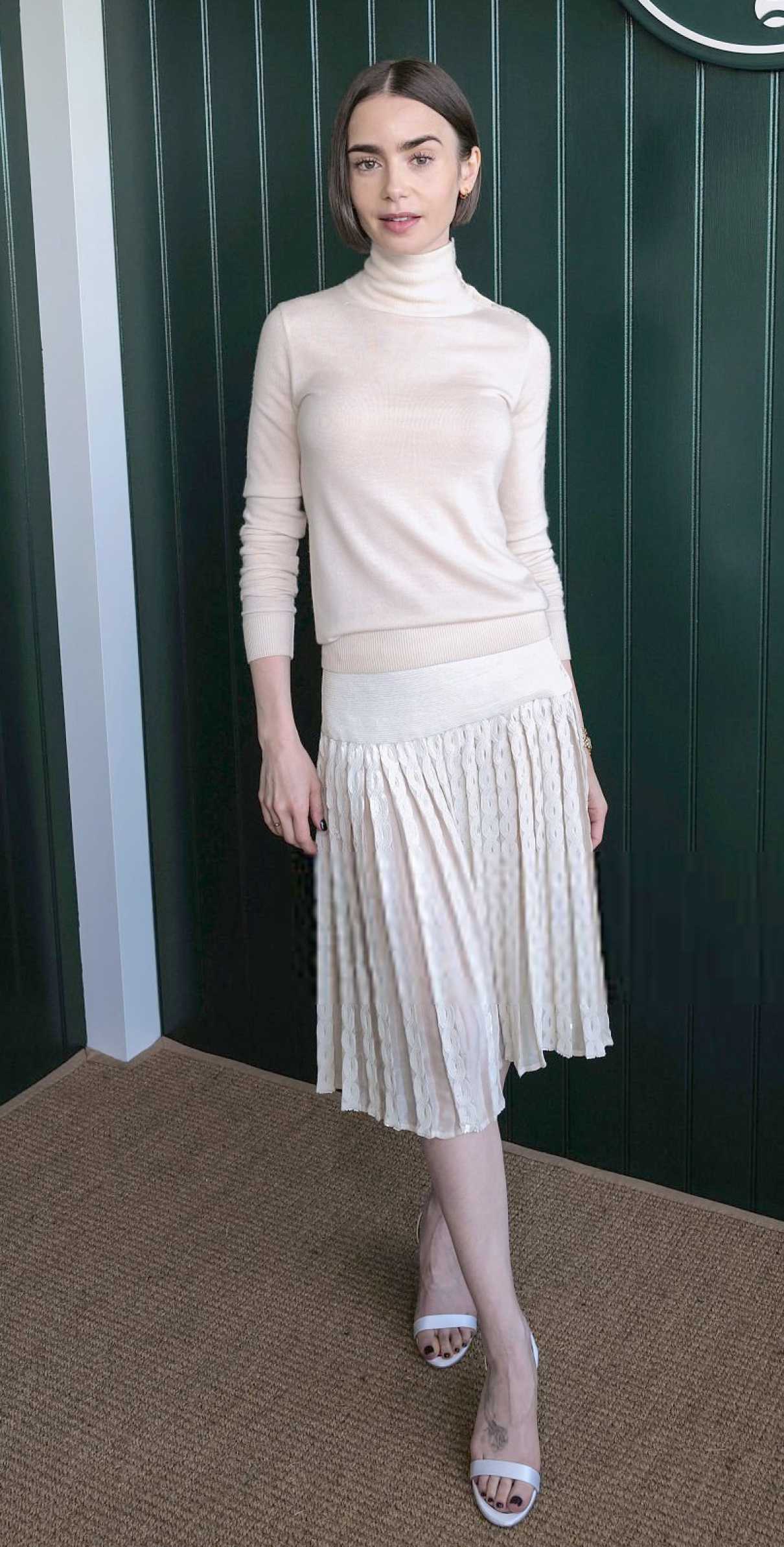 Lily Collins Attends Day 13 of 2026 Wimbledon Tennis Championships in London 07/11/2026