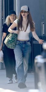 Madelaine Petsch in a Beige Blouse