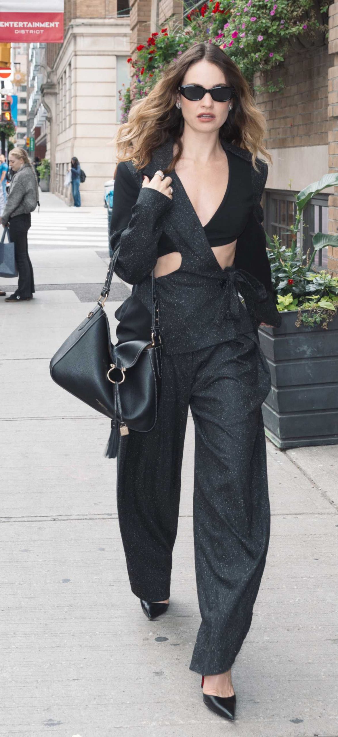 Lily James in a Black Pantsuit